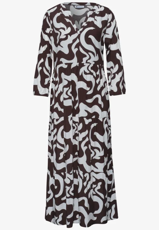 Langärmliges Maxikleid mit schwarzem und weißem abstraktem Muster und V-Ausschnitt.