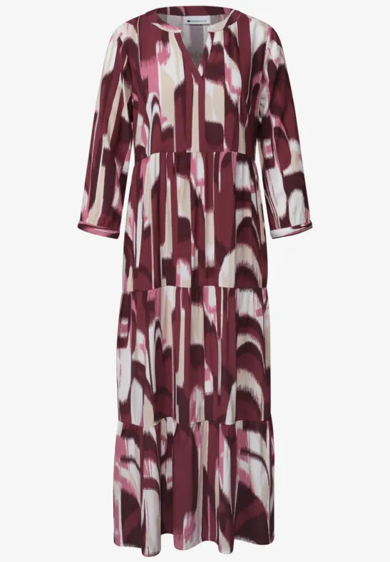 Middellange jurk met driekwart mouwen en abstracte print in bordeaux, roze en wit.