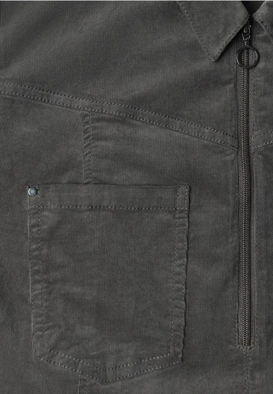 Donker overhemd met borstzak, verticale rits en metalen ringdetail