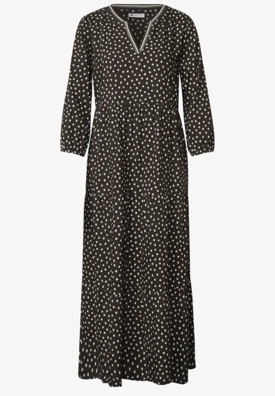 Schwarz-weiß gepunktetes Maxikleid mit V-Ausschnitt, langen Ärmeln und lockerem Fall.