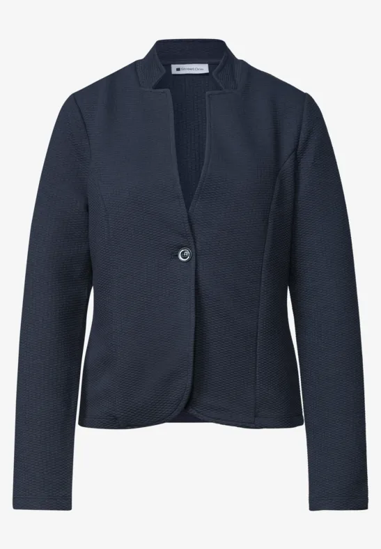 Blazer féminin bleu marine cintré, simple boutonnage à un bouton, col à revers épuré.