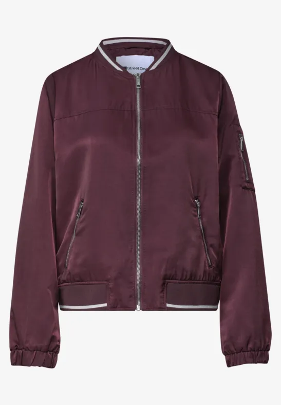Bordeauxrote Bomberjacke mit Reißverschluss, seitlichen Taschen und elastischen Bündchen.
