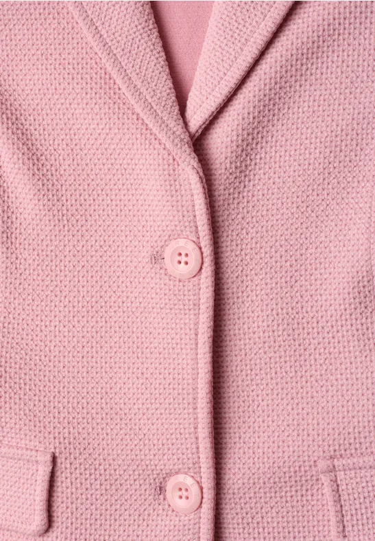 Rosa strukturierter Blazer mit zwei Knöpfen und seitlichen Taschen.