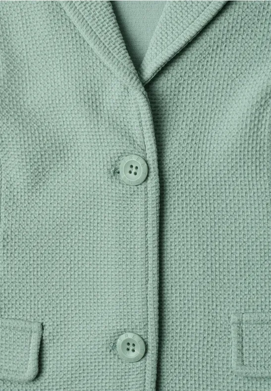Mintgrüner, texturierter Blazer mit Reverskragen, zwei Knöpfen und aufgesetzten Taschen.