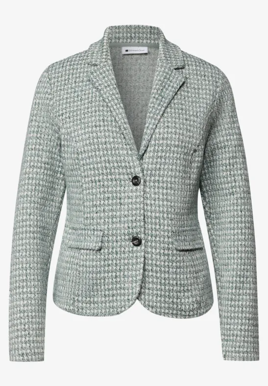 Blazer féminin cintré en tweed vert-blanc, col à revers et deux boutons.