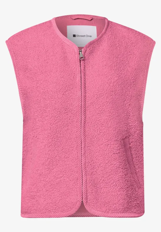 Roze fleece bodywarmer met rits aan de voorkant, twee zijzakken, mouwloos en zacht.