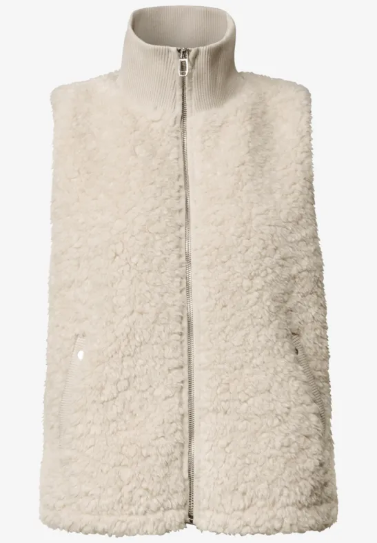 Gilet sans manches en fausse fourrure crème, col montant et fermeture éclair.