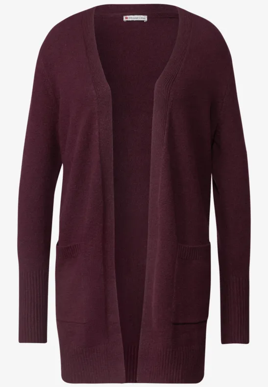 Cardigan en tricot bordeaux, ouvert, manches longues et poches plaquées.