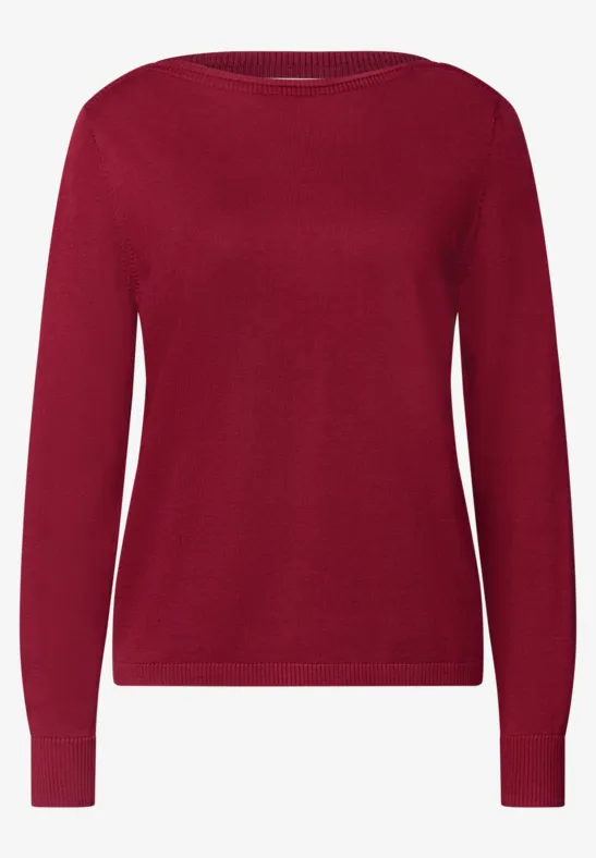 Ein roter Pullover mit langen Ärmeln und Rundhalsausschnitt