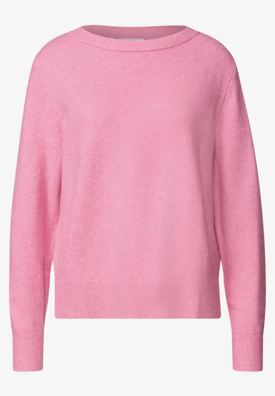 Ein rosa Pullover mit Rundhalsausschnitt und langen Ärmeln.