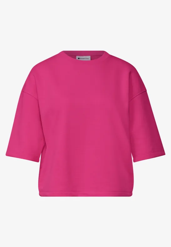 Fuksjowy, luźny t-shirt z krótkimi rękawami i okrągłym dekoltem.