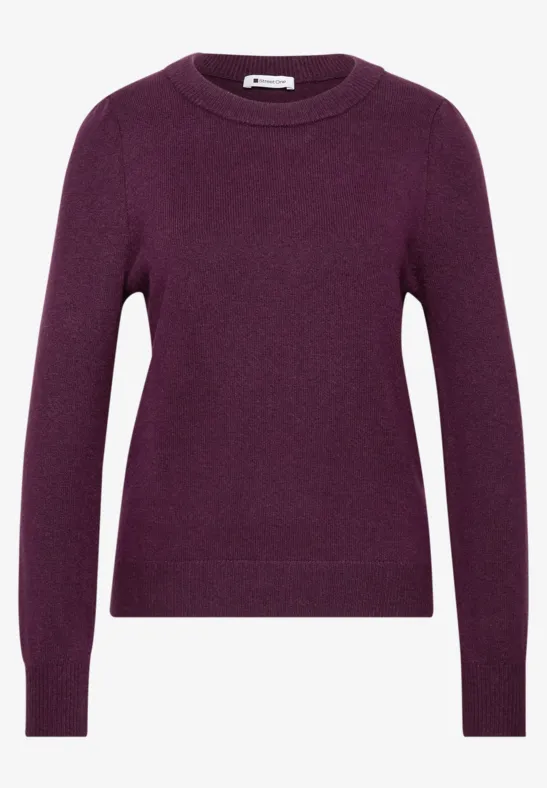 Ein einfaches lila Rundhals-Pullover mit langen Ärmeln.
