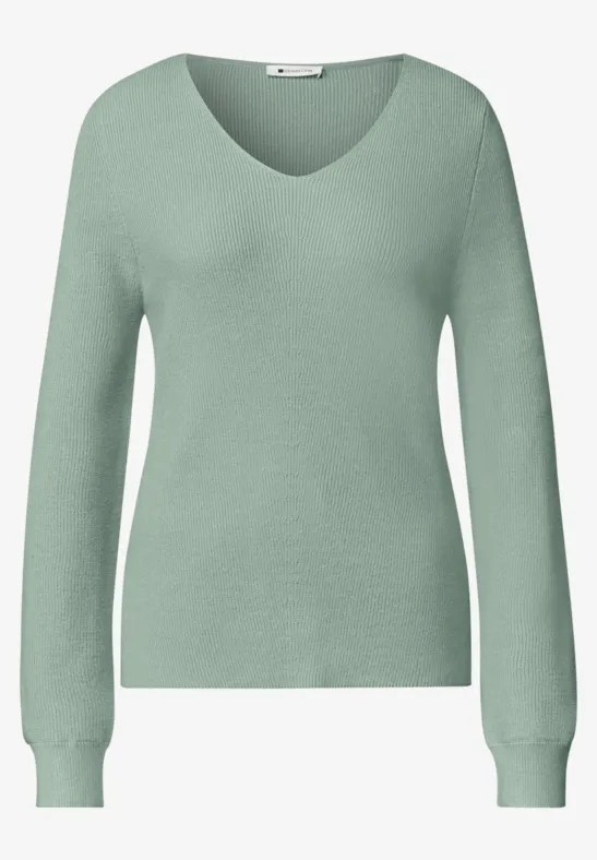 Hellgrüner Langarm-Pullover mit V-Ausschnitt für Damen.