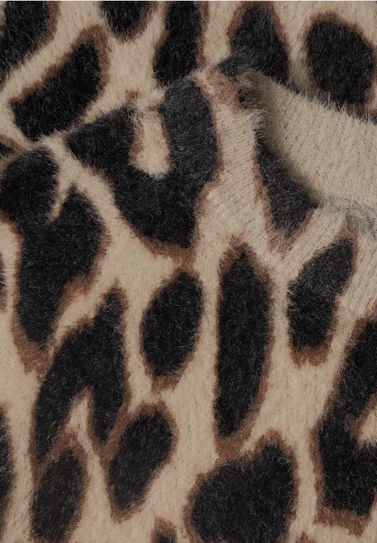 Nahaufnahme eines beige-braunen Leopardenmusters mit schwarzen Flecken.