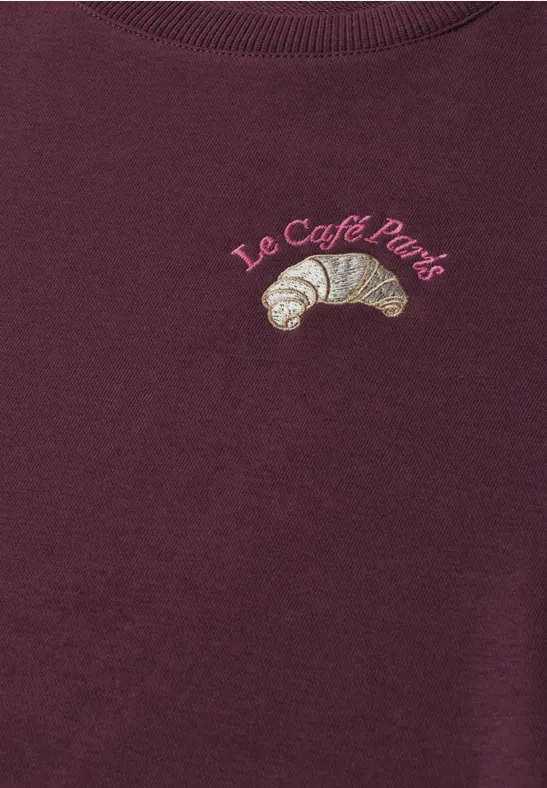 Bordowa bluza z haftowanym croissantem w barwach francuskich i napisem “Le Café Paris”