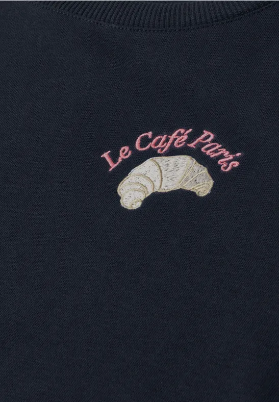 Dunkelblauer Pullover mit gesticktem Croissant und Schriftzug "Le Café Paris".