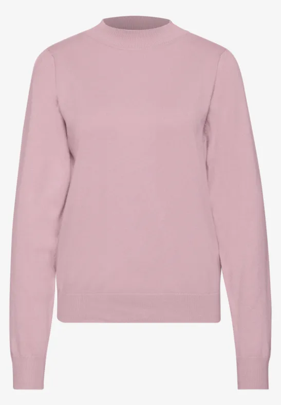 Ein schlichtes, hellrosa Langarm-Pullover ohne Muster.