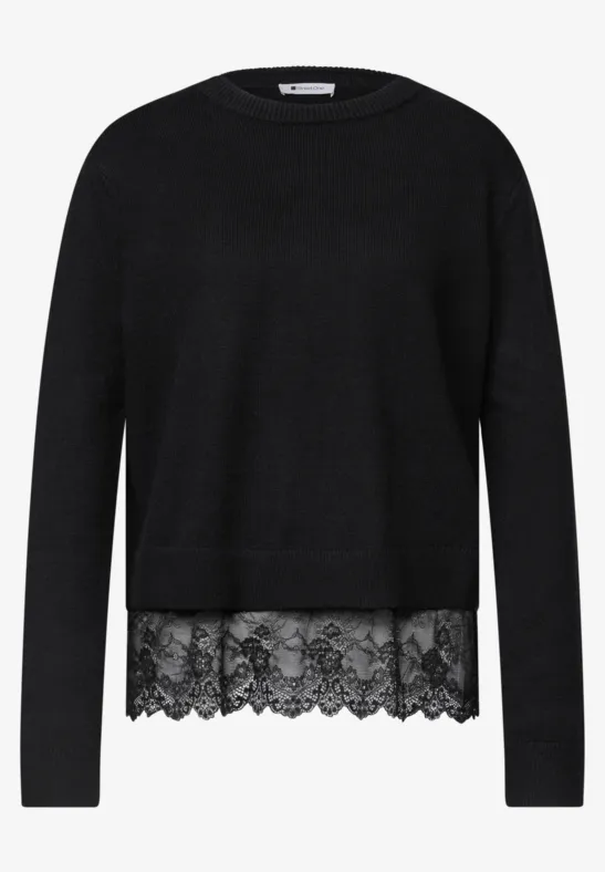 Schwarzer Pullover mit rundem Ausschnitt und Spitzenbesatz am Saum.
