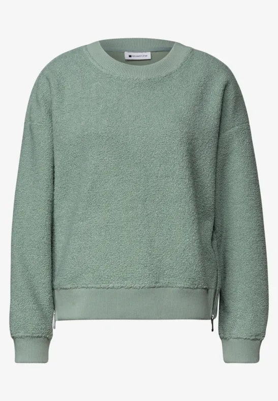 Hellgrünes Fleece-Sweatshirt mit Rundhalsausschnitt, langen Ärmeln und seitlichen Reißverschlüssen.
