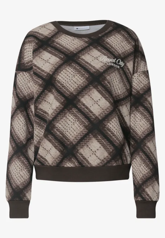 Pull beige à motif écossais noir et marron, manches longues et bord-côtes élastiques.