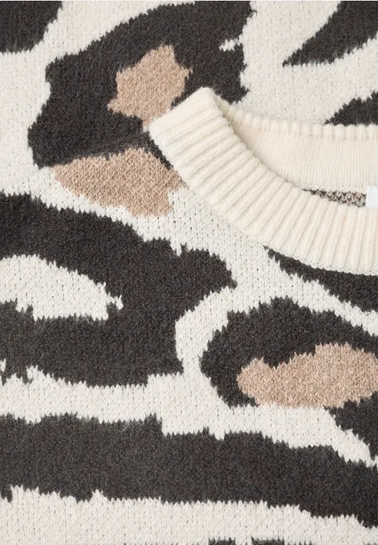 Pull tricoté à motif zèbre en crème, noir et marron