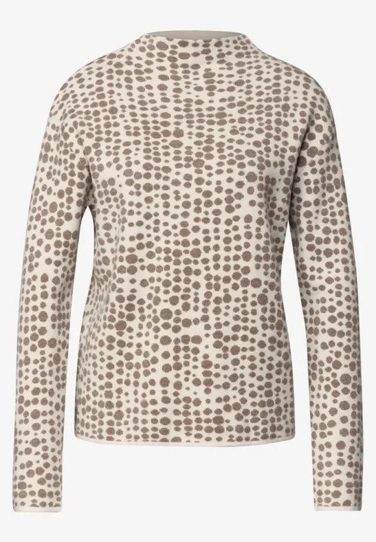 Beige Langarmshirt mit braunen Punkten, Rückansicht.