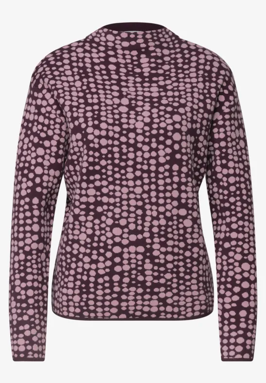 Dunkelvioletter Pullover mit langem Arm und hellrosa Tupfenmuster.