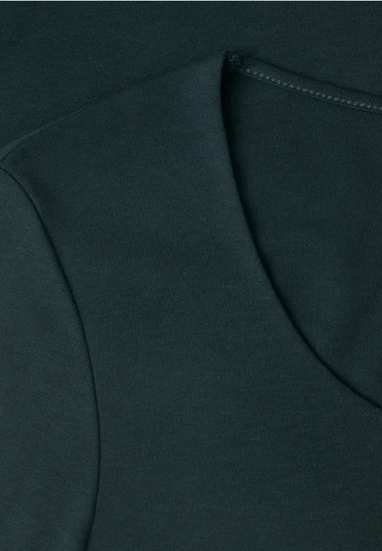 T-shirt vert foncé à col rond avec couture apparente