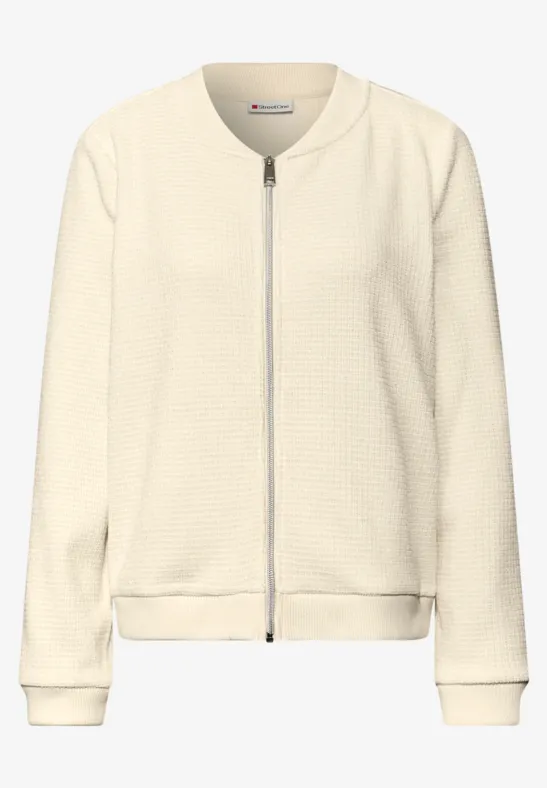 Jasje met glinsterende structuur soft beige