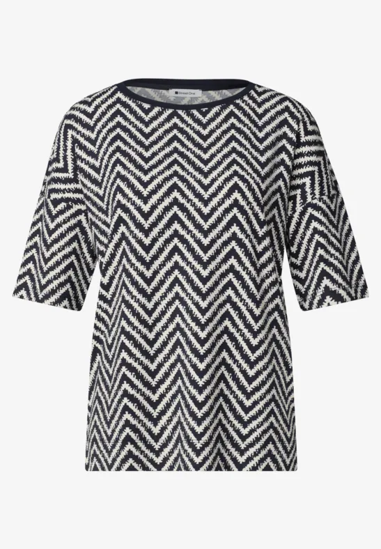 Damen-T-Shirt mit halblangen Ärmeln und schwarz-weißem Zickzack-Muster.