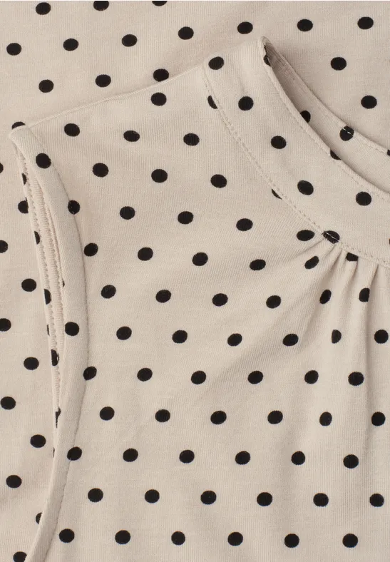 Beige Stoff mit schwarzen Punkten