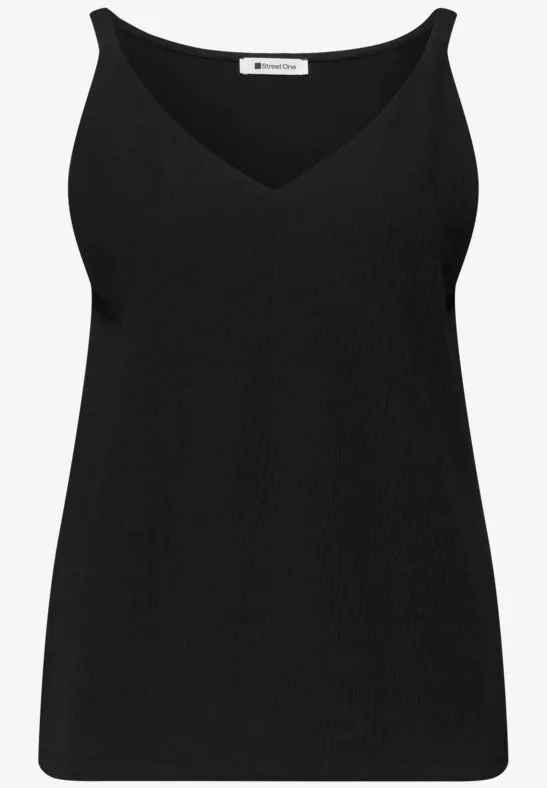 Zwart mouwloos topje met V-hals.