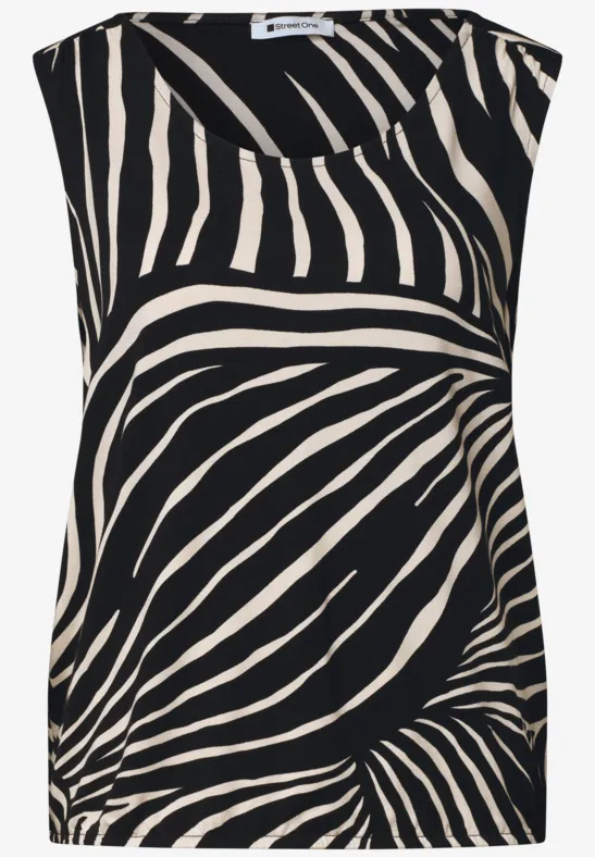 Mouwloze, losvallende top met beige zebraprint op zwarte achtergrond.