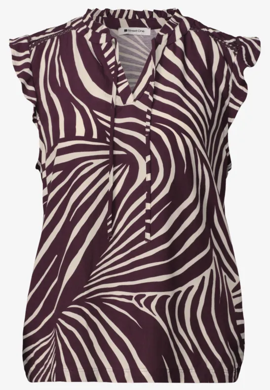 Mouwloze blouse met bruin-wit zebraprint, V-hals met koordjes en ruches op de schouders