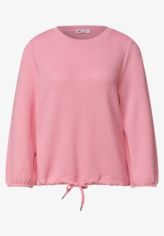 Ein locker geschnittener rosa Pullover mit Rundhalsausschnitt und Kordelzug am Saum.