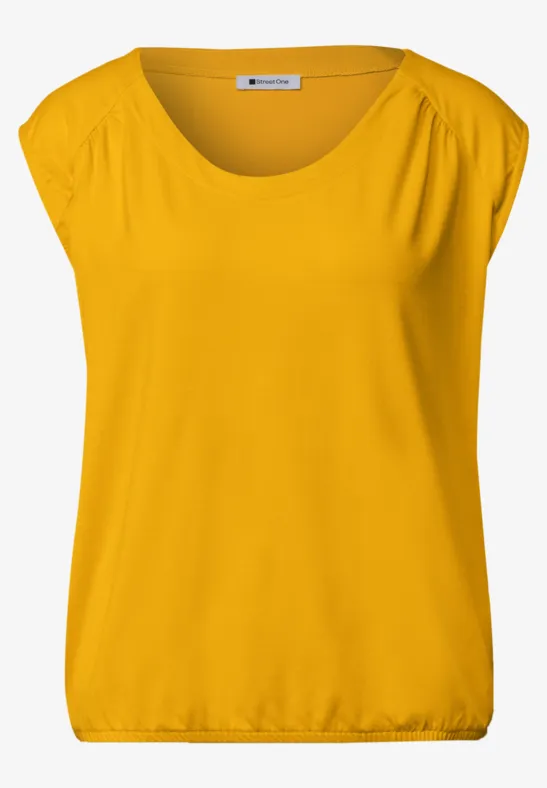 Top sans manches jaune pour femme, encolure ronde et coupe ample.