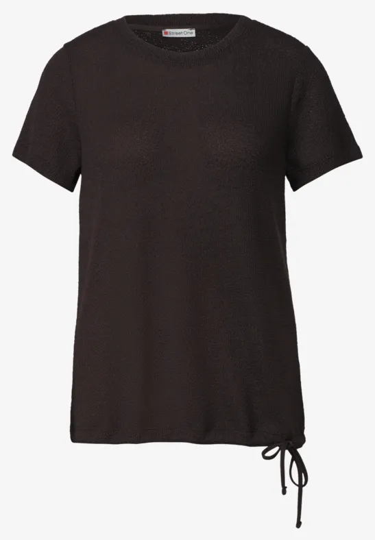 zwart T-shirt met korte mouwen en zijsnoer aan de zoom