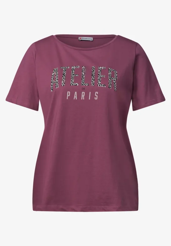 Paars dames-T-shirt met glanzende tekst 'ATELIER PARIS' op de voorkant.