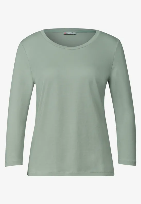 Ein schlichtes, langärmliges T-Shirt in hellem Mintgrün.