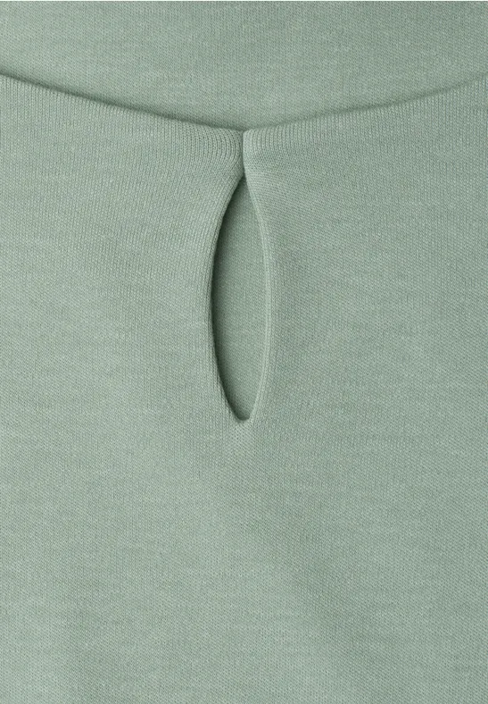 Tissu vert pâle avec petite découpe en goutte