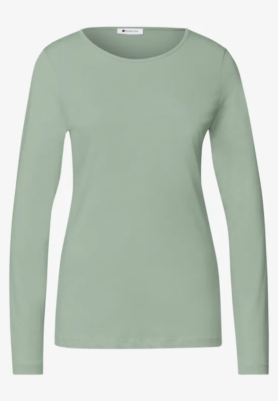Effen lichtgroen damesshirt met lange mouwen en ronde hals, aansluitende pasvorm.