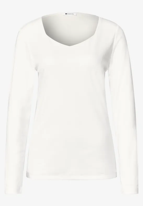 T-shirt femme blanc à manches longues et col rond.