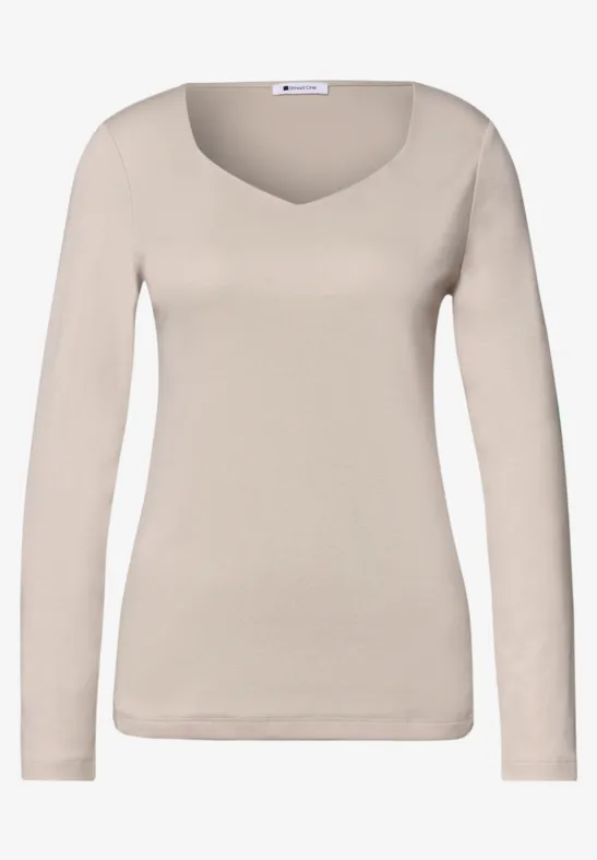 T-shirt à manches longues pour femme, beige, col rond, style épuré.