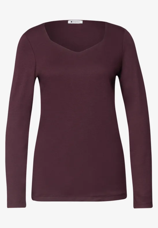 T-shirt femme à manches longues couleur prune foncé avec décolleté en V subtil.