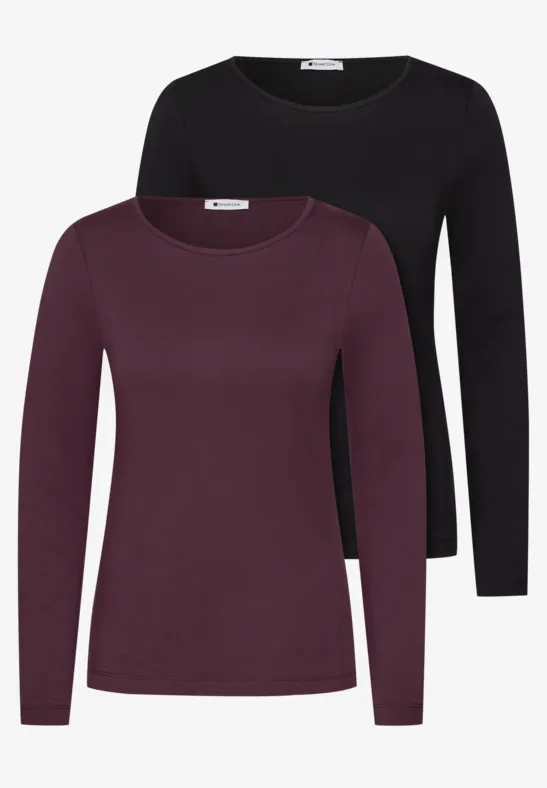 Zwei schlichte Langarmshirts für Damen, eines in Schwarz, eines in Dunkelrot.