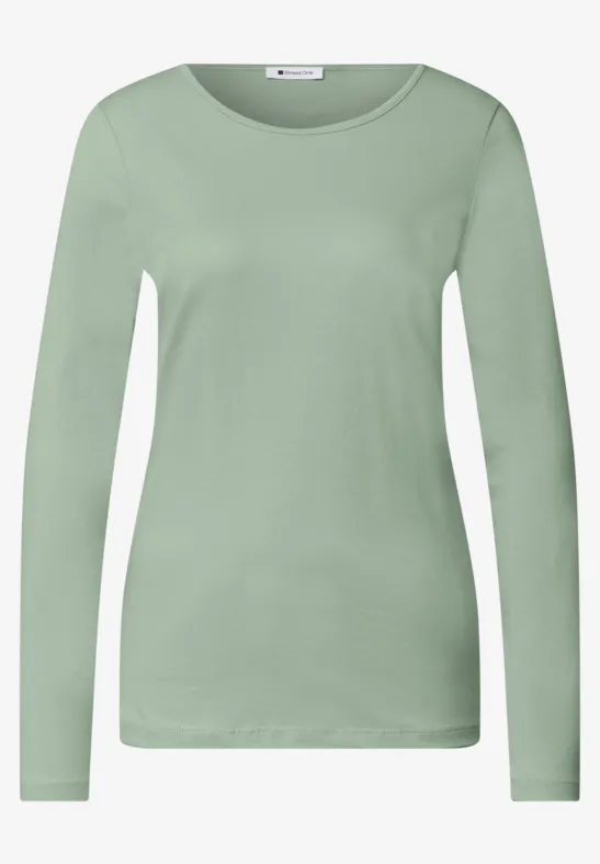 T-shirt manches longues vert clair pour femme avec encolure ronde.
