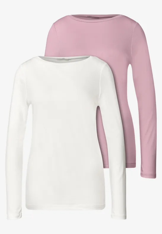 Zwei schlichte Langarmshirts in Weiß und Rosa mit rundem Ausschnitt.