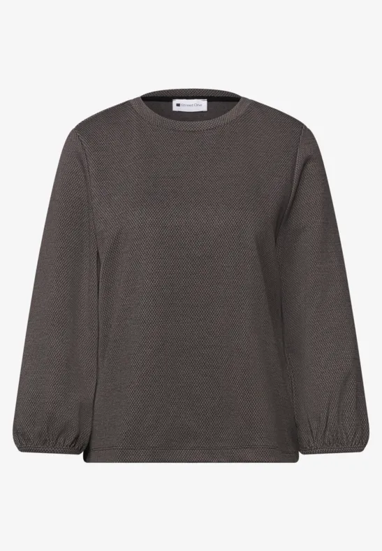 Ein graues Langarmshirt mit Rundhalsausschnitt und elastischen Bündchen.