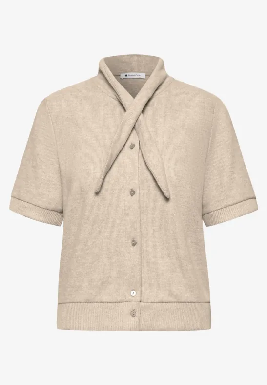 Beige Kurzarmjacke aus Frottee mit Knopfleiste und modischem Kragenband.