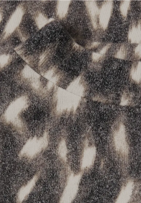 Abstract zwart-witpatroon met licht- en schaduwvlekken die doen denken aan boombladeren.